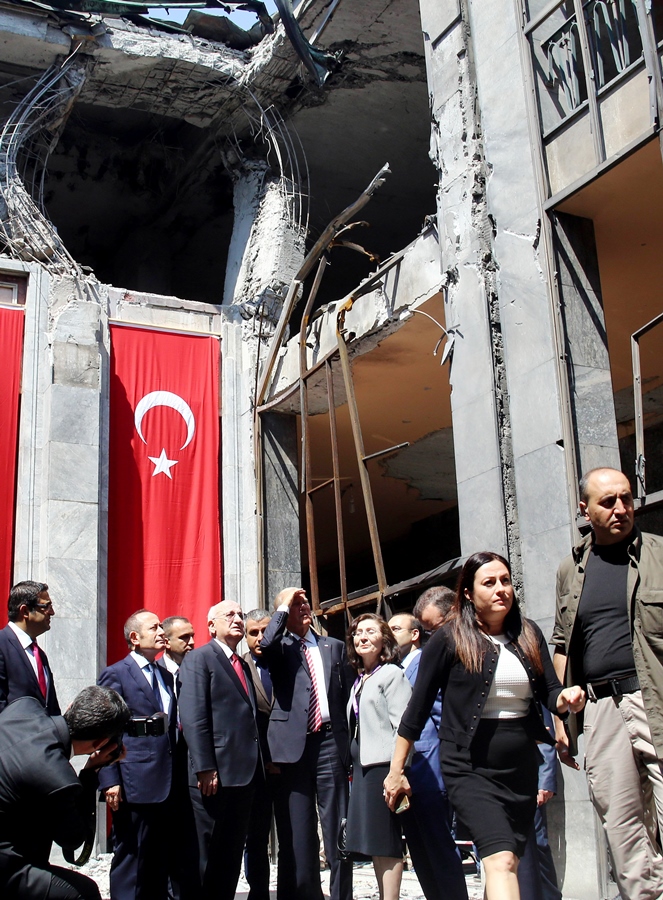 U.S. Vice President Joe Biden with İsmail Kahraman (Speaker of the Parliament) inspect the bombed Parliament building on August 24, 2016.   AFP PHOTO / STRINGER