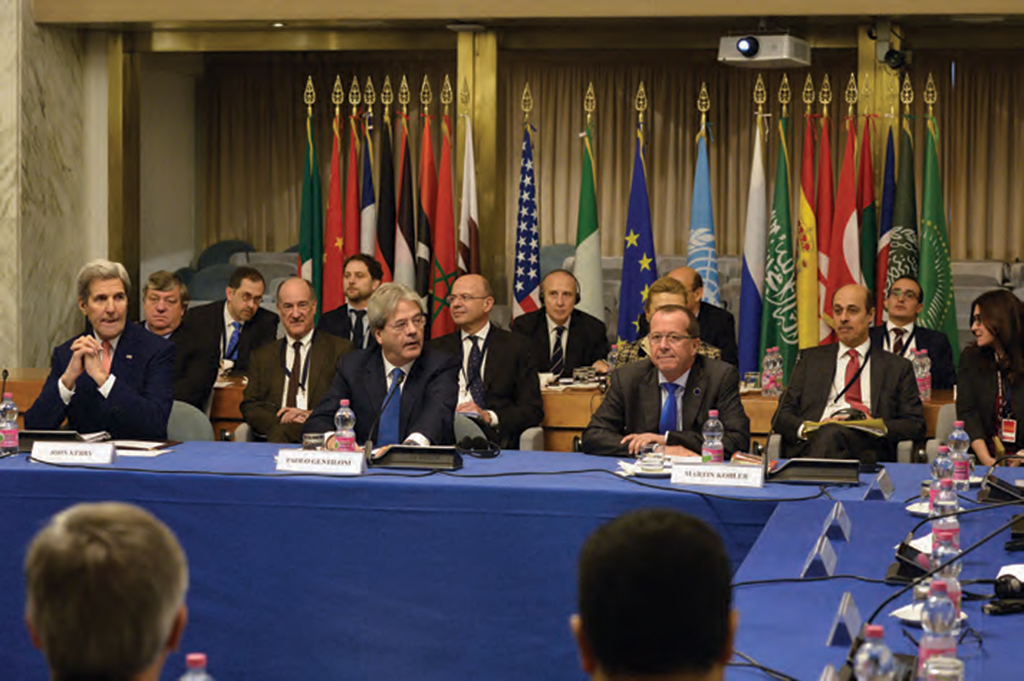 Then U.S. Secretary of State John Kerry, Italian FM Paolo Gentiloni and special representative for the UN Martin Kobler, attend an international meeting on Libya, on December 13, 2015 in Rome. AFP PHOTO /  TIZIANA FABI