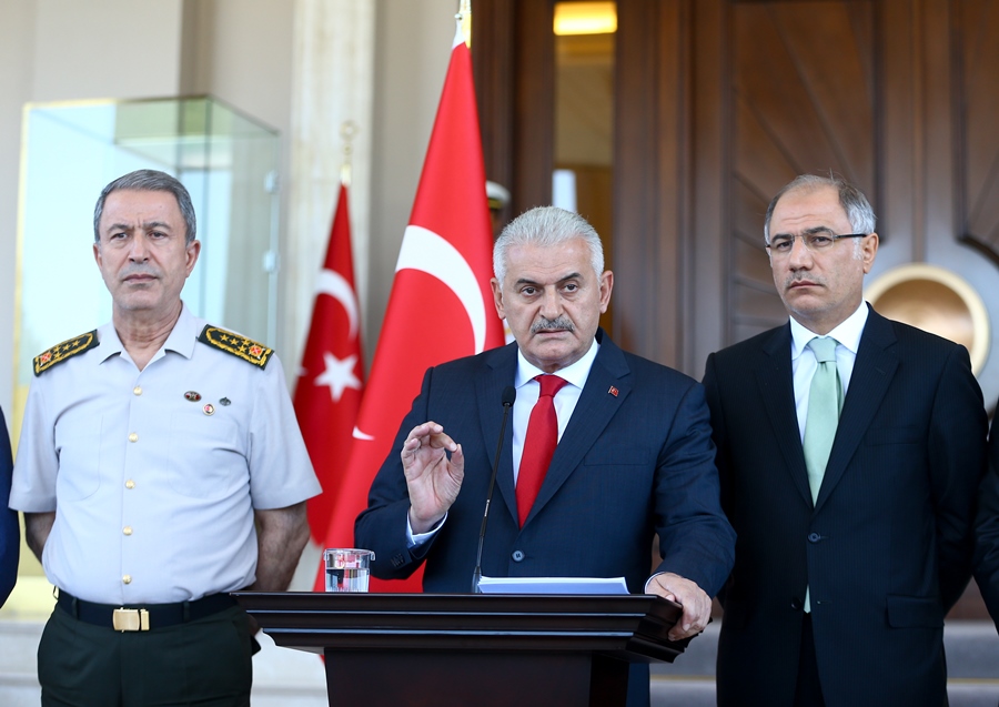 The Turkish PM Binali Yıldırım, makes the first official statement on the morning of July 16, along with Gen. Hulusi Akar (Chief of General Staff) and Efkan Ala (Minister of Interior Affairs).   AA PHOTO /  ERÇİN TOP