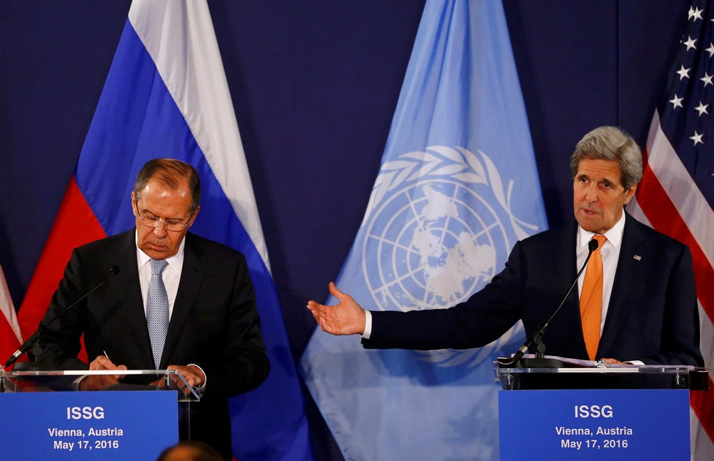 U.S. Secretary of State John Kerry speaks next to Russian Foreign Minister Sergei Lavrov during