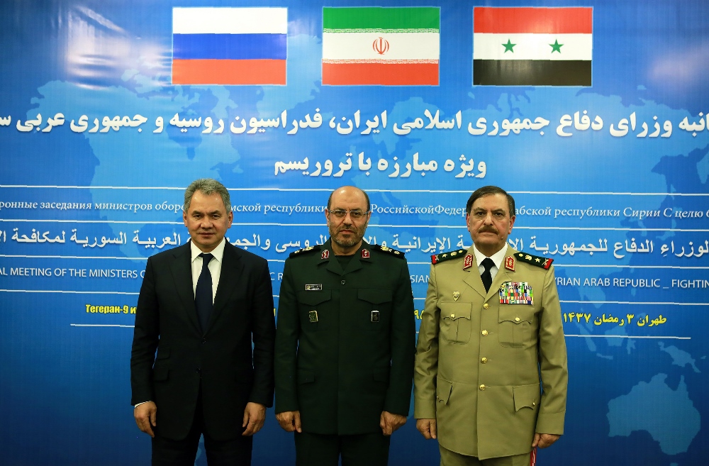 A handout picture released by the official website of the Iranian Defence Ministry shows the Defence Ministers of Iran, Hossein Dehqan (C), Russia, Sergei Shoigu (L), and Syria Fahd Jassem al-Frei (R), as they meet for talks in Tehran on pressing the fight against opponents of the Syrian regime on June 9, 2016. AFP PHOTO / IRANIAN DEFENCE MINISTRY / HO