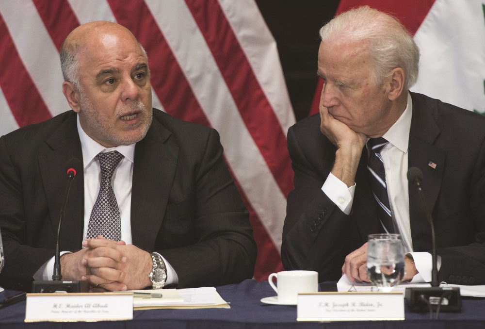 US Vice President Joe Biden and Iraqi Prime Minister Haider al-Abadi hold a meeting of the US-Iraq Higher Coordinating Committee in the Eisenhower Executive Office Building on  April 16, 2015. AFP PHOTO / SAUL LOEB