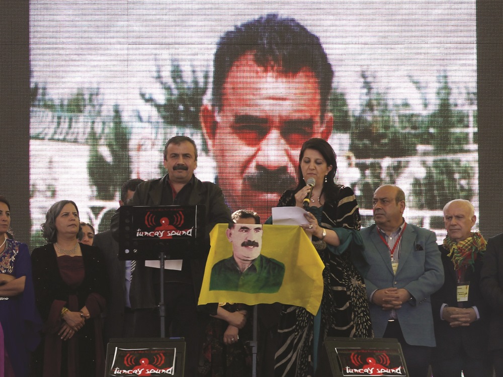 Sirri Sureyya Onder (L) and Pelvin Buldan (R) read Abdullah Ocalan’s message on March 21, 2013, in the southern Turkish city of Diyarbakir. STR / AFP